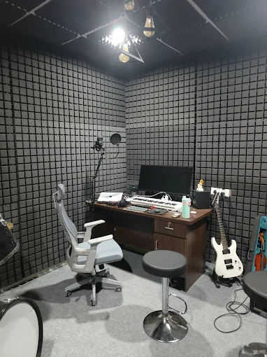 Rocksmith Records recording room with workstation and instruments